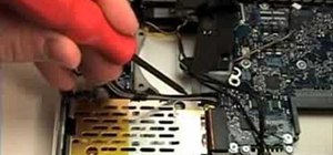 Remove the MagSafe board from a 15" MacBook Pro