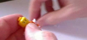 Widen a LEGO mini-figure's arm motion for brickfilms