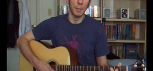 Play the chords to "Jingle Bells" on the guitar