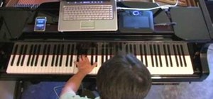 Play Claude Debussy's "Claire de lune" on the piano