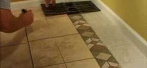 Install a decorative tile border