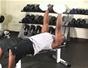 Do a bench press with household materials