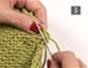 Sew seams together on a knitted garment