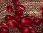 Remove pomegranate seed with a spoon