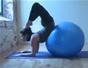 Use a medicine ball for a yoga forearm stand