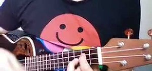 Perform "Somewhere Over the Rainbow" on the ukulele