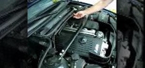 Remove a BMW E46 ignition cover to find ignition coils