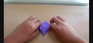 Make an origami crane from folded paper