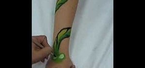Apply paint to create a "Snake Arm Band"