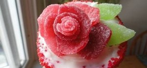 Make a rose adorned cupcake with cherry candy slices