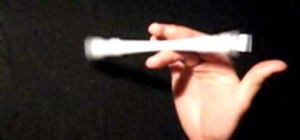 Do the Fingerpass Reverse pen spinning trick