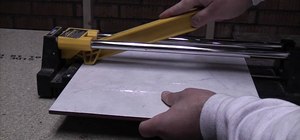 Cut ceramic floor and wall tile with a tile cutter