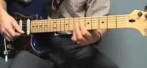 Play a  funk chord groove on the guitar