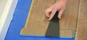 Install laminate floor under a door