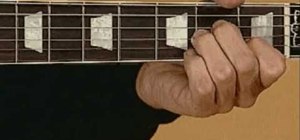 Play the Beatles' "Let it Be" on acoustic guitar