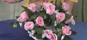 Make a wedding centerpiece with pink silk flowers