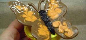 Decorate a cupcake with a candy monarch butterfly