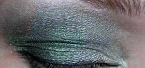 Apply silver and emerald green eyeshadow