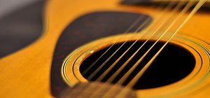 Play chords on acoustic and electric guitars