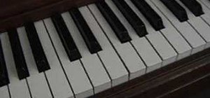 Play "Let It Be" by the Beatles on the piano