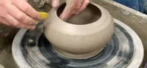 Use the chattering surface technique to sculpt a tall form pot