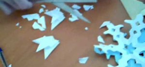 Make three different origami snowflakes