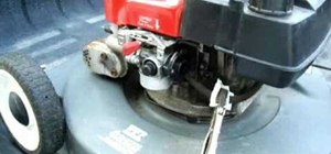 Clean out the carburetor on a push lawn mower