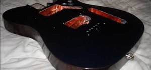 Paint a Fender Telecaster electric guitar